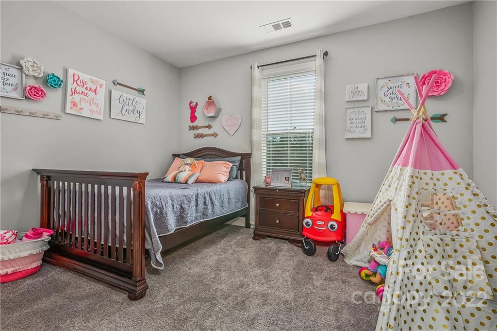 624 Spur Alley, Unit 19 Rutherfordton, NC 28139 - Photo 10 of 41 a bedroom with a bed and a window
