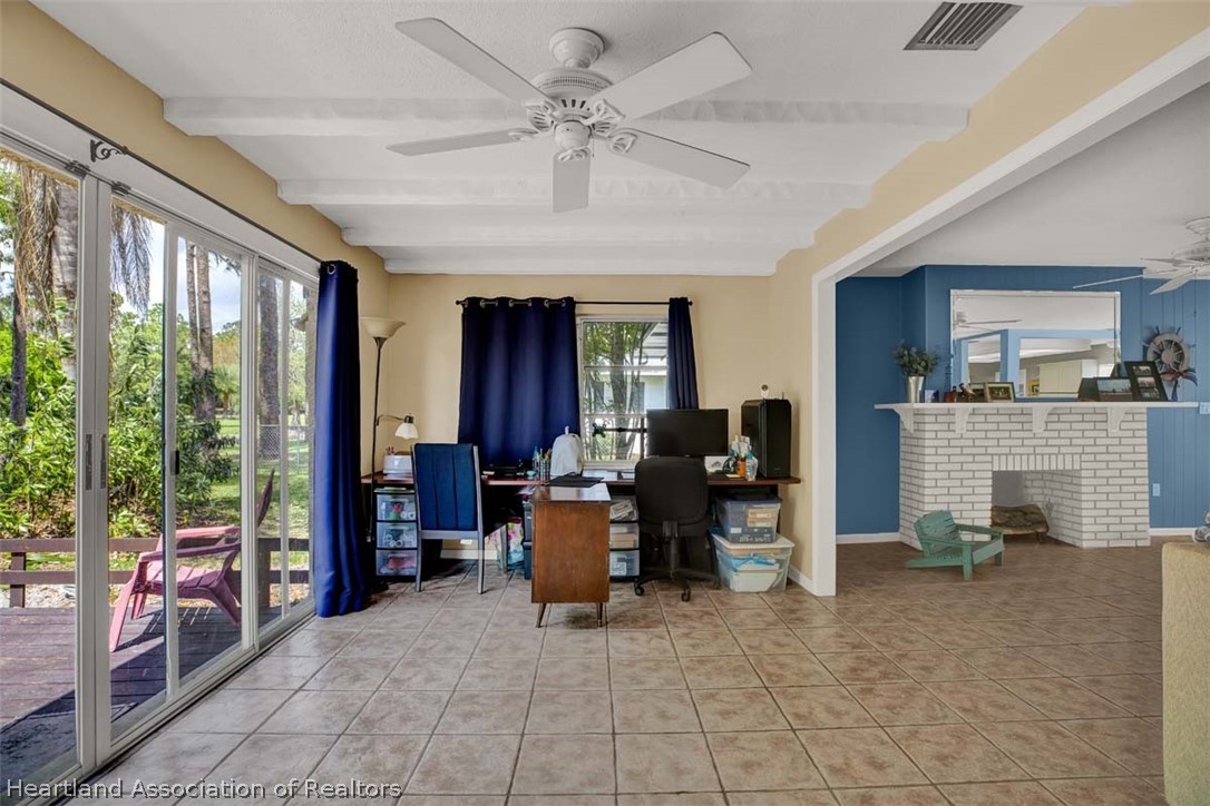 3232 Golfview Road Sebring, FL 33875 - Photo 20 of 36 a view of a livingroom with furniture and a window