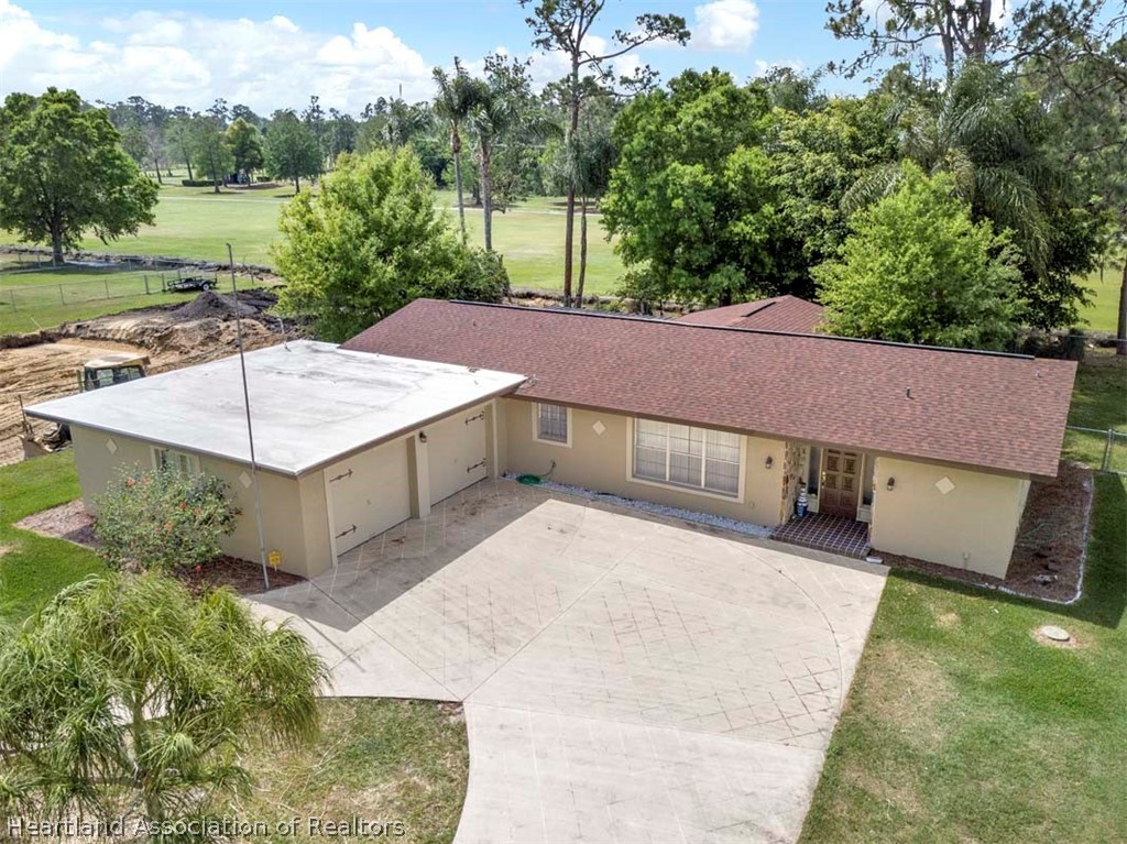 3232 Golfview Road Sebring, FL 33875 - Photo 29 of 36 an aerial view of a house with a yard