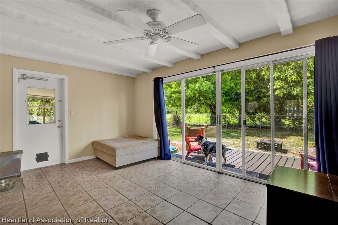 3232 Golfview Road Sebring, FL 33875 - Photo 5 of 36 a living room with furniture and a large window