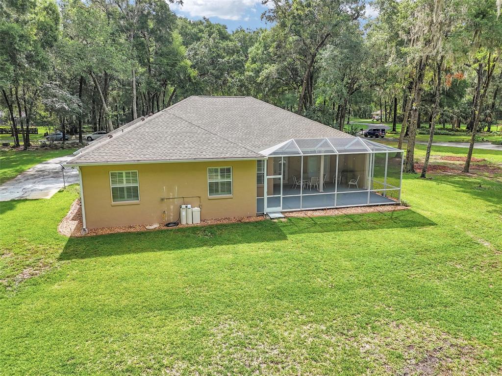 1989 Northwest 111th Loop Ocala, FL 34475 - Photo 39 of 55 a front view of a house with a garden