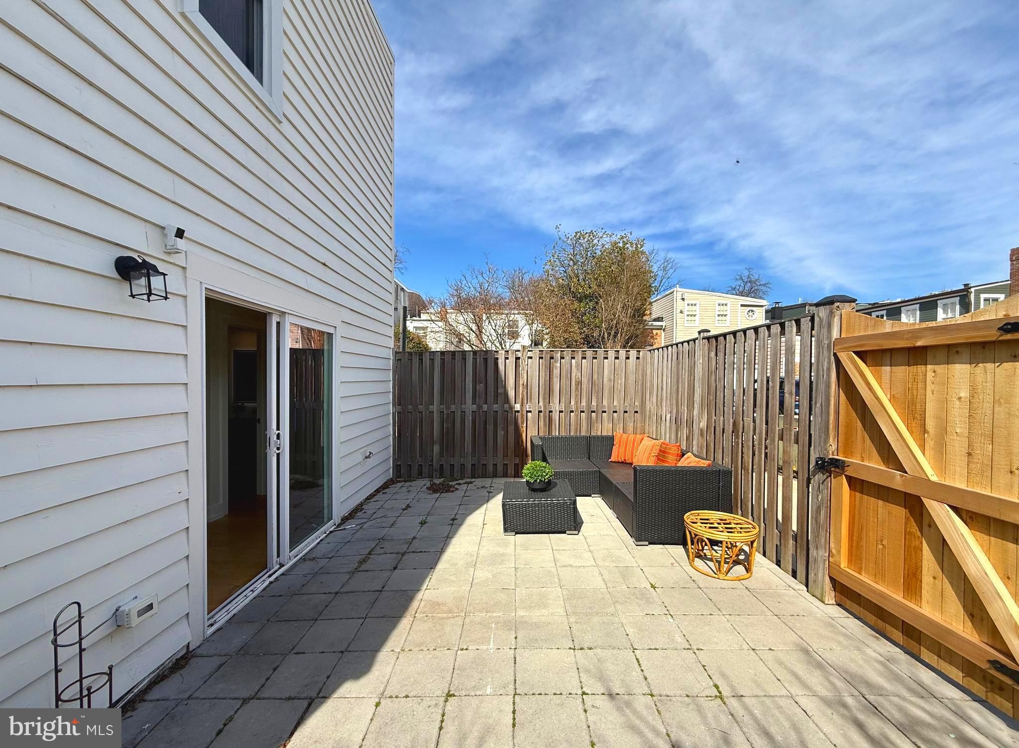 310 South Alfred Street Alexandria, VA 22314 - Photo 26 of 63 a view of balcony with wooden floor and outdoor seating