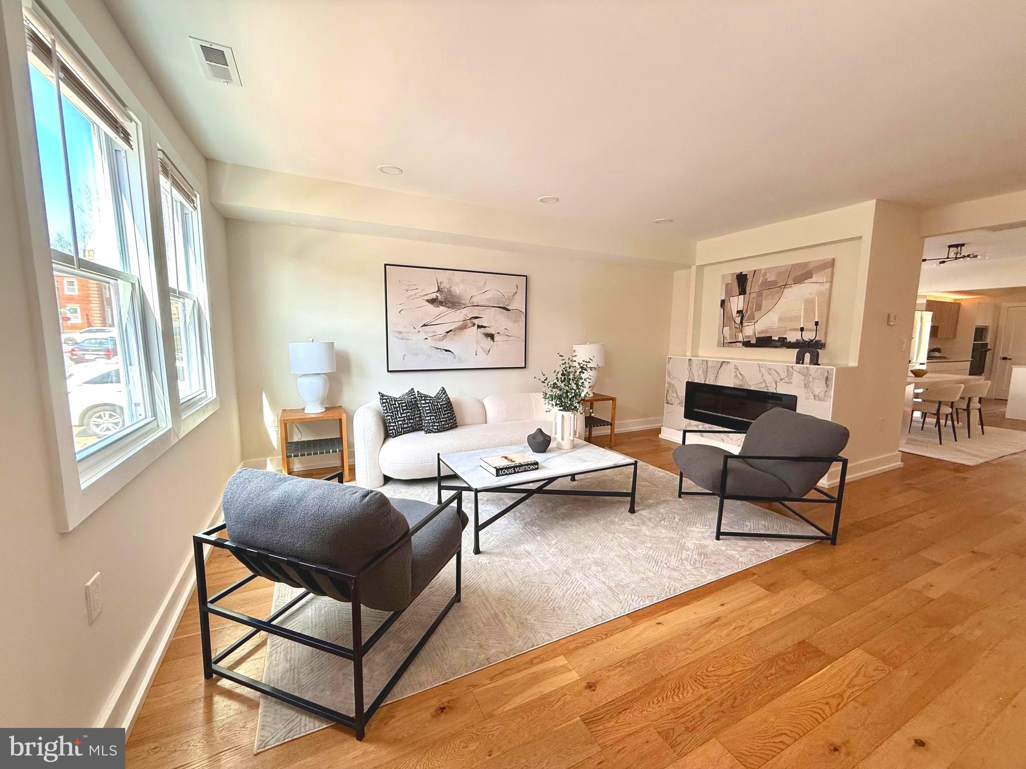 310 South Alfred Street Alexandria, VA 22314 - Photo 4 of 63 a living room with furniture or couch and two windows