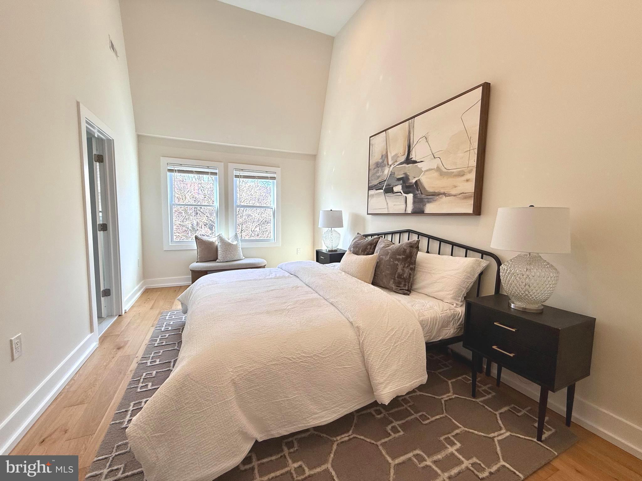 310 South Alfred Street Alexandria, VA 22314 - Photo 41 of 63 a bedroom with a bed and wooden floor