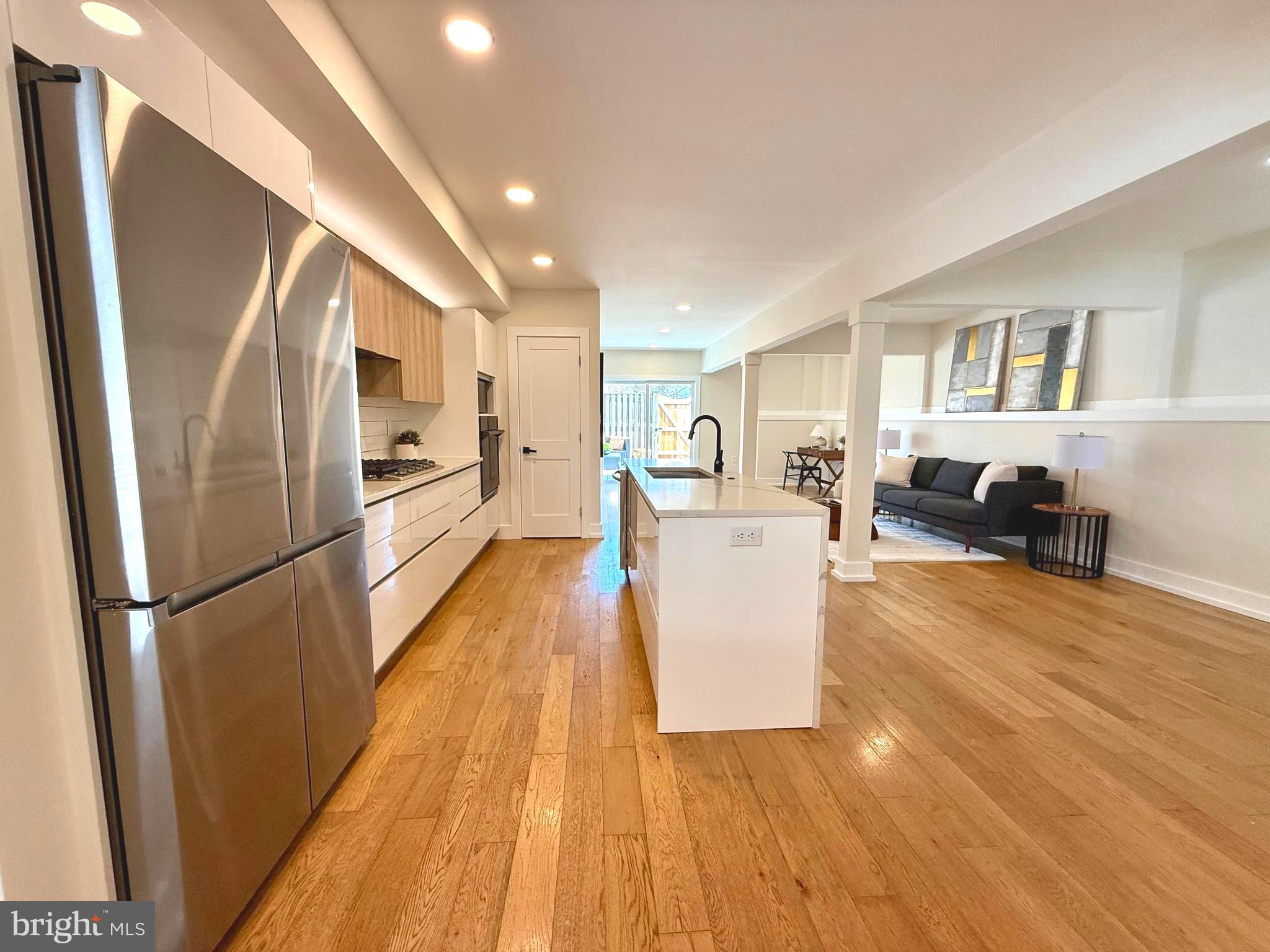 310 South Alfred Street Alexandria, VA 22314 - Photo 8 of 63 a living room with furniture and a wooden floor