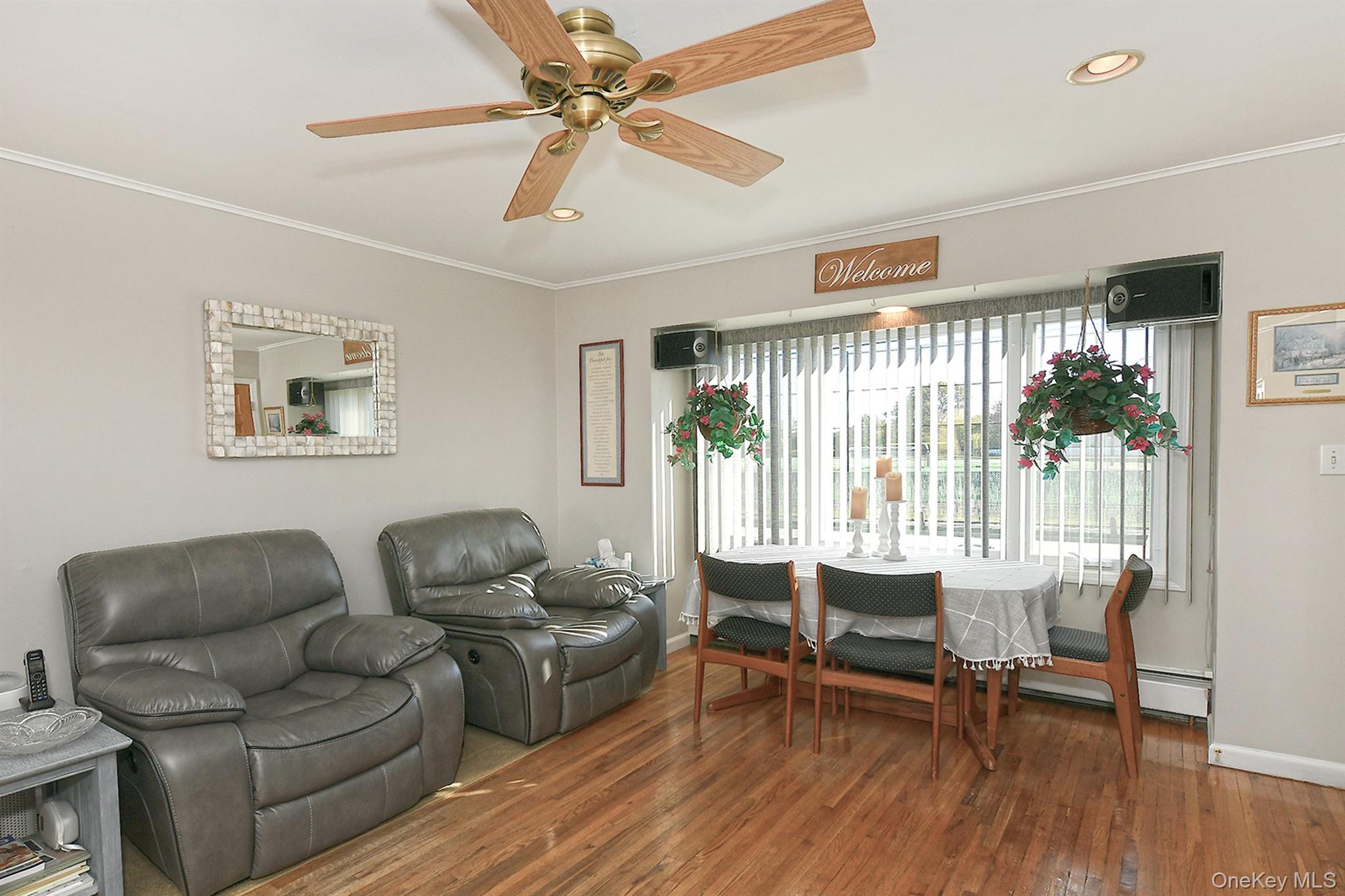 115 Old Farmingdale Road West Babylon, NY 11704 - Photo 11 of 30 a living room with furniture and a large window