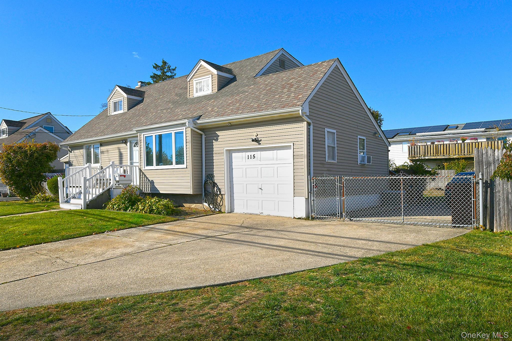 115 Old Farmingdale Road West Babylon, NY 11704 - Photo 2 of 30 a front view of a house with garden