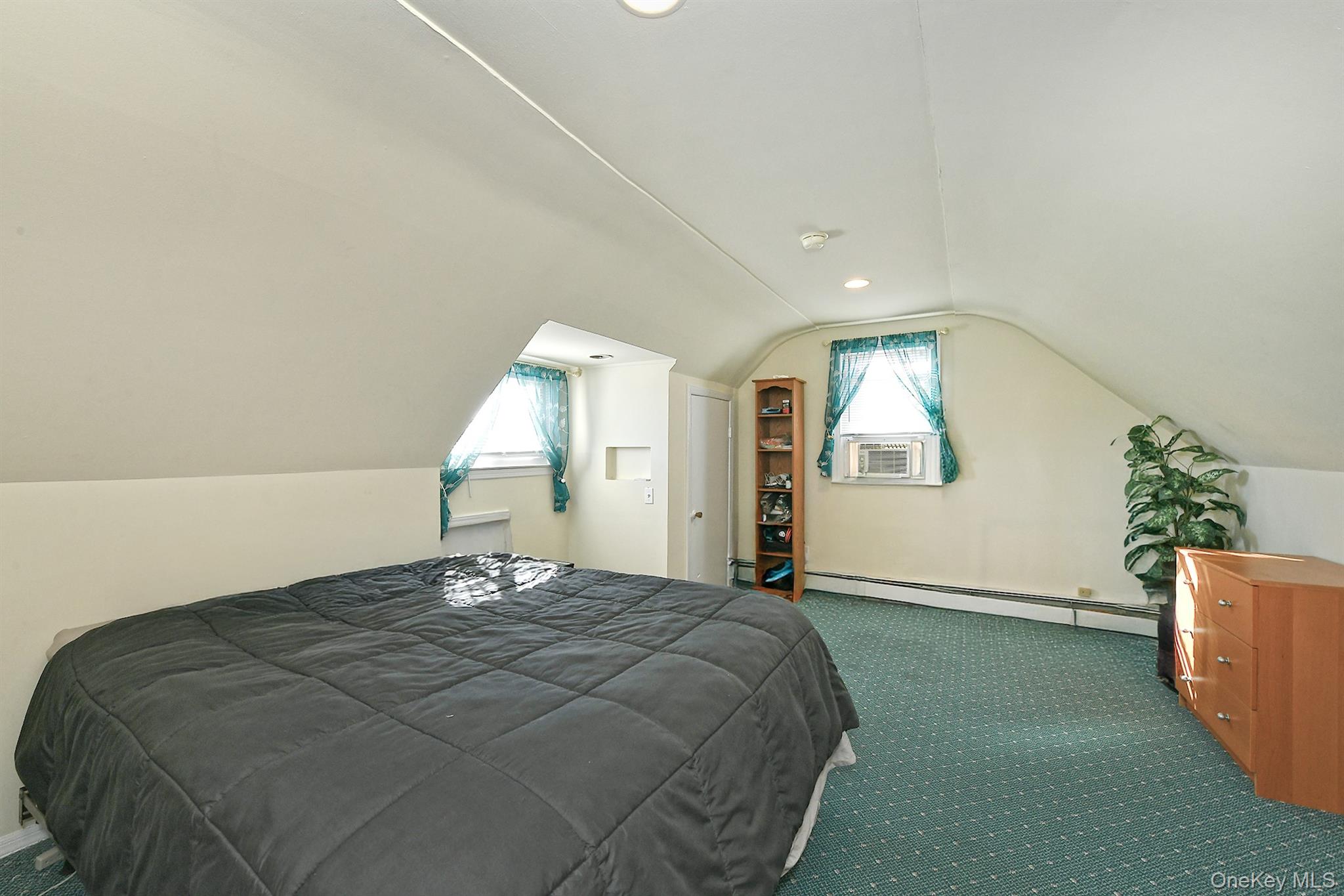 115 Old Farmingdale Road West Babylon, NY 11704 - Photo 23 of 30 a bedroom with a bed and window