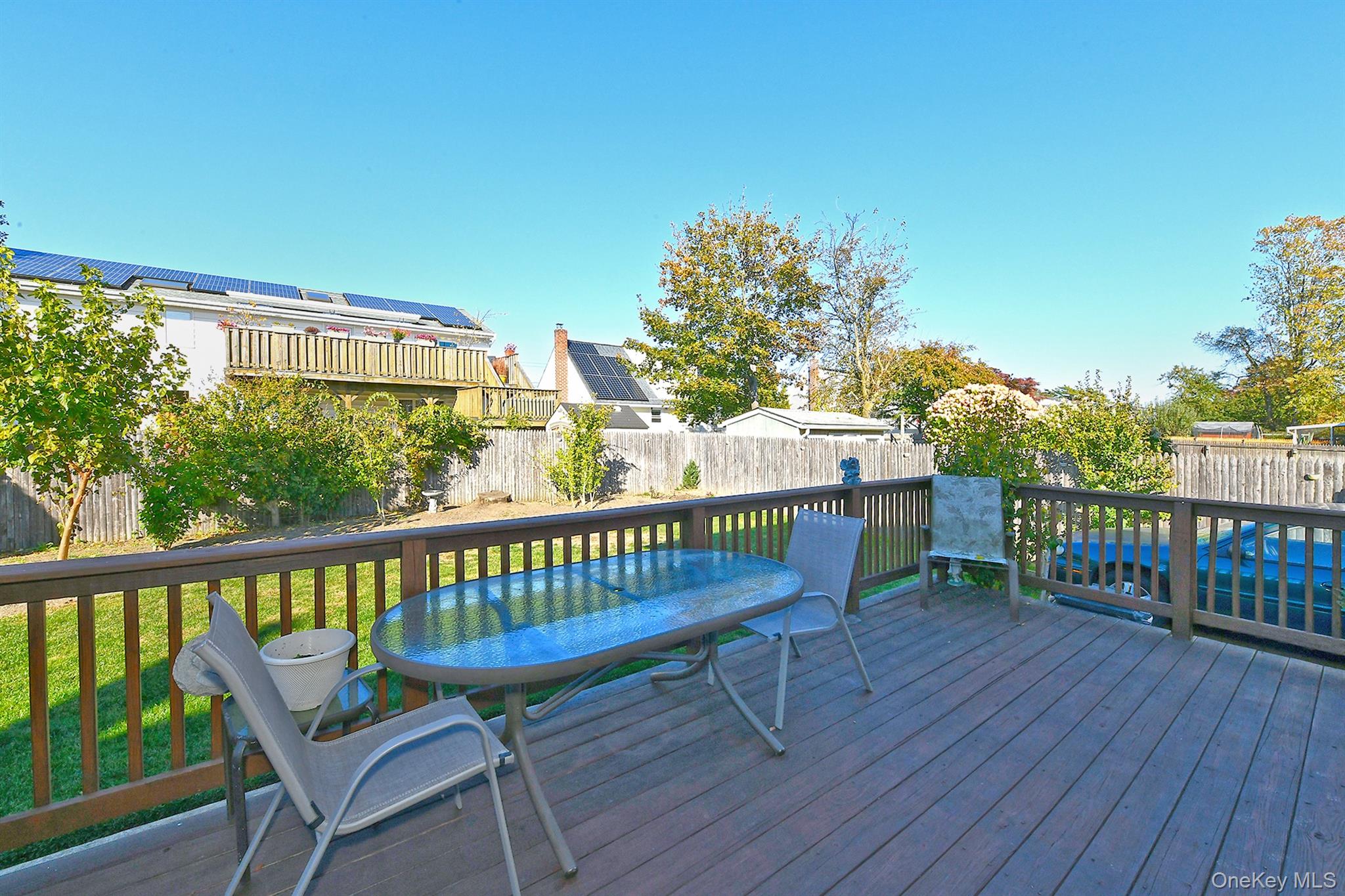 115 Old Farmingdale Road West Babylon, NY 11704 - Photo 26 of 30 a view of a chair in wooden deck