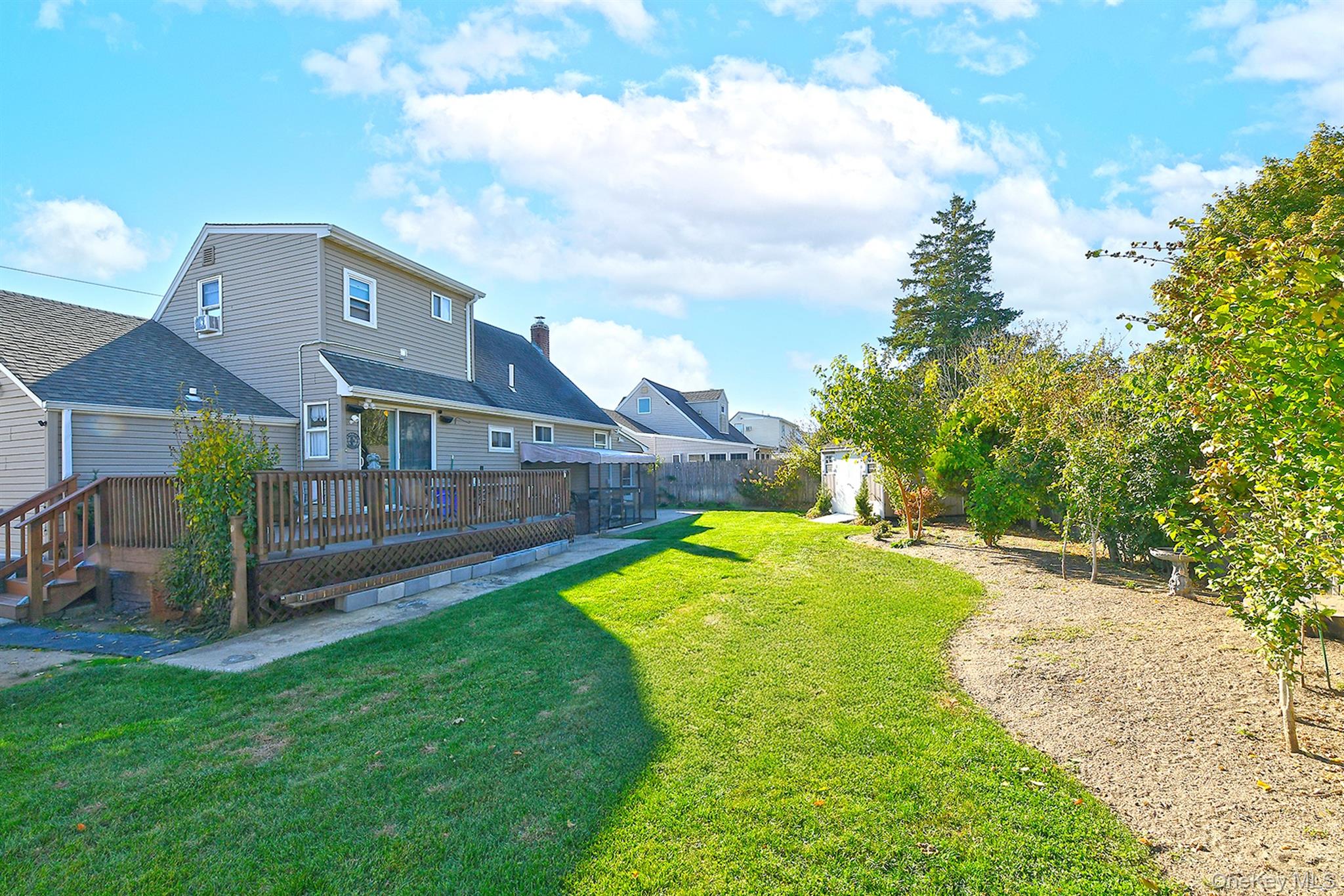 115 Old Farmingdale Road West Babylon, NY 11704 - Photo 28 of 30 a view of yard with swimming pool and deck