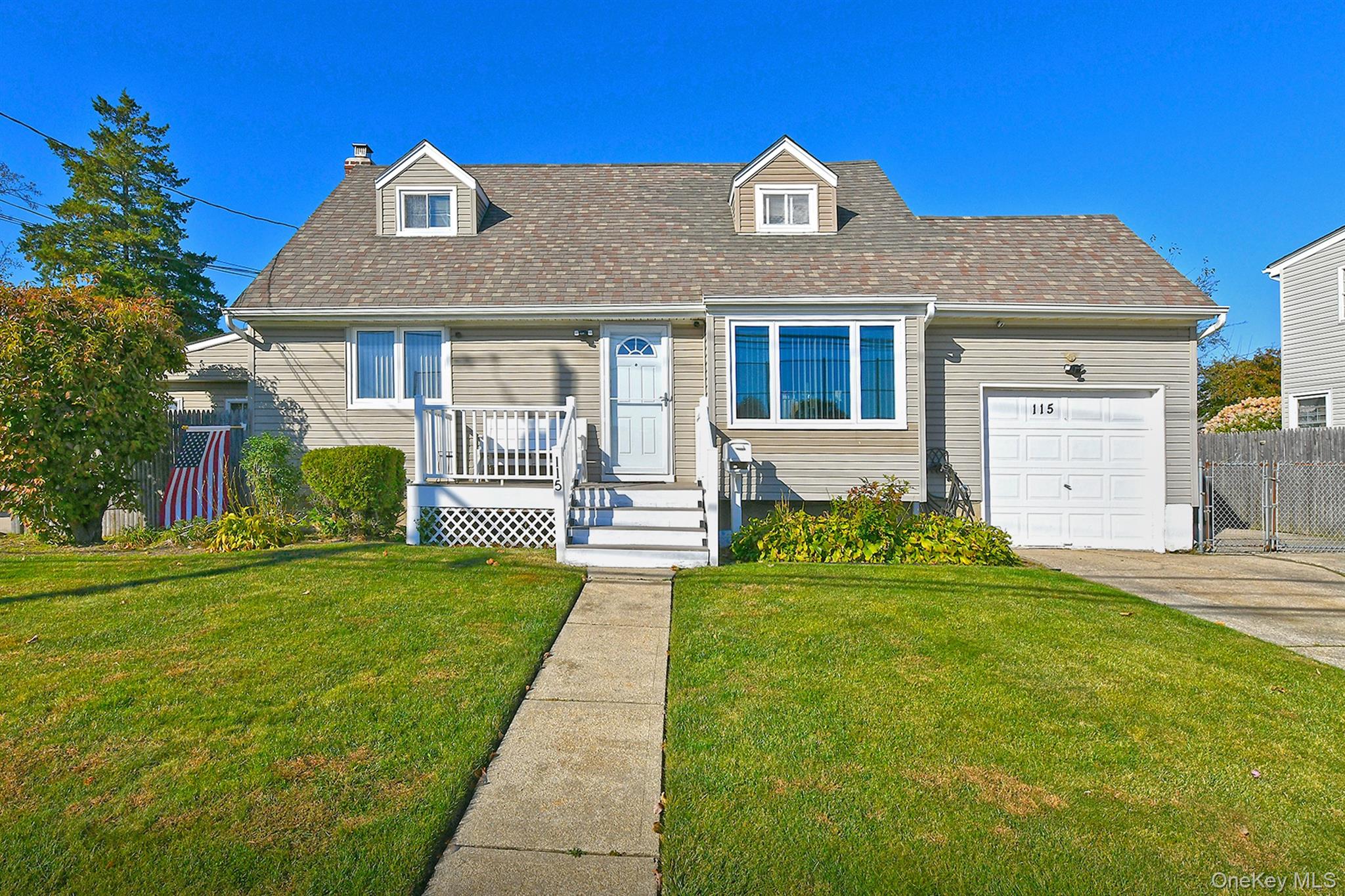 115 Old Farmingdale Road West Babylon, NY 11704 - Photo 4 of 30 a front view of a house with a yard