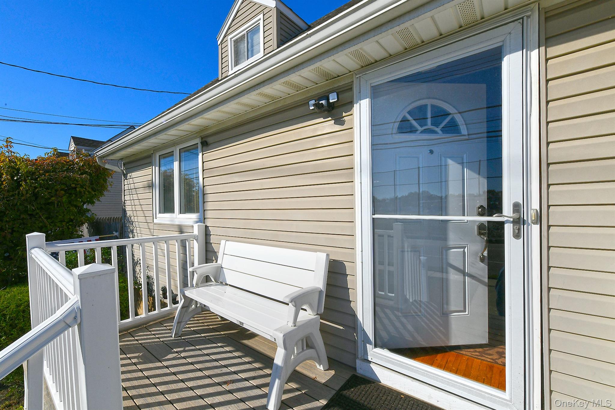 115 Old Farmingdale Road West Babylon, NY 11704 - Photo 6 of 30 a view of balcony with wooden floor and seating space