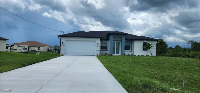 a front view of house with yard and green space