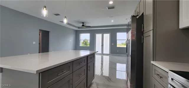 a kitchen with a refrigerator and countertop