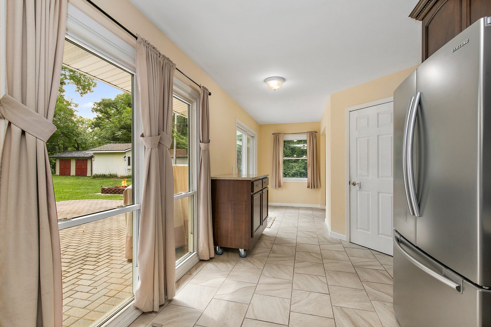 1026 Oak Ridge Road Carpentersville, IL 60110 - Photo 12 of 25 a view of a kitchen with refrigerator and wooden floor