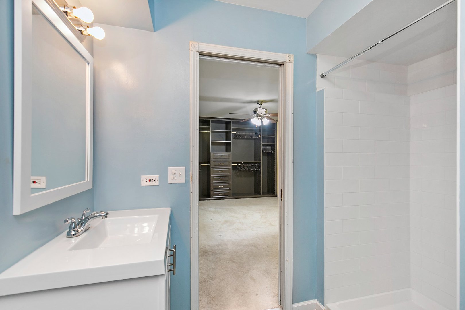 1026 Oak Ridge Road Carpentersville, IL 60110 - Photo 15 of 25 a bathroom with a sink and mirror
