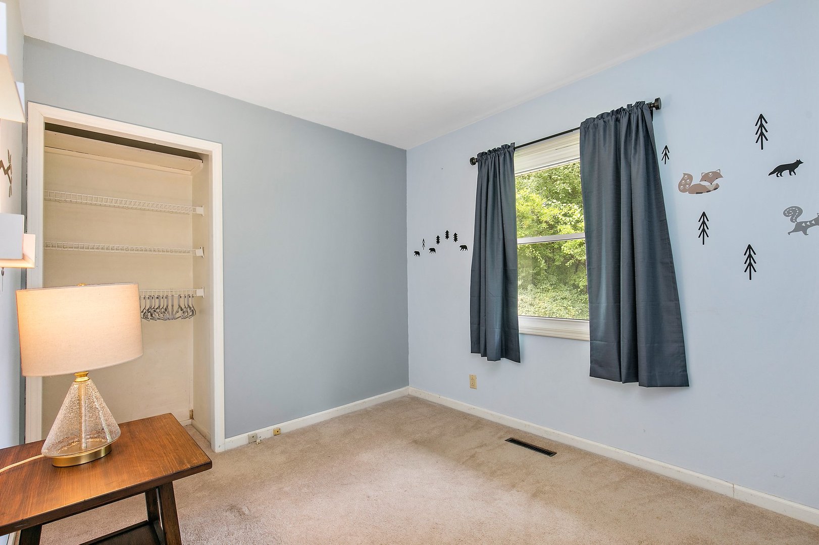 1026 Oak Ridge Road Carpentersville, IL 60110 - Photo 16 of 25 a view of a room that has a window and a dresser in it