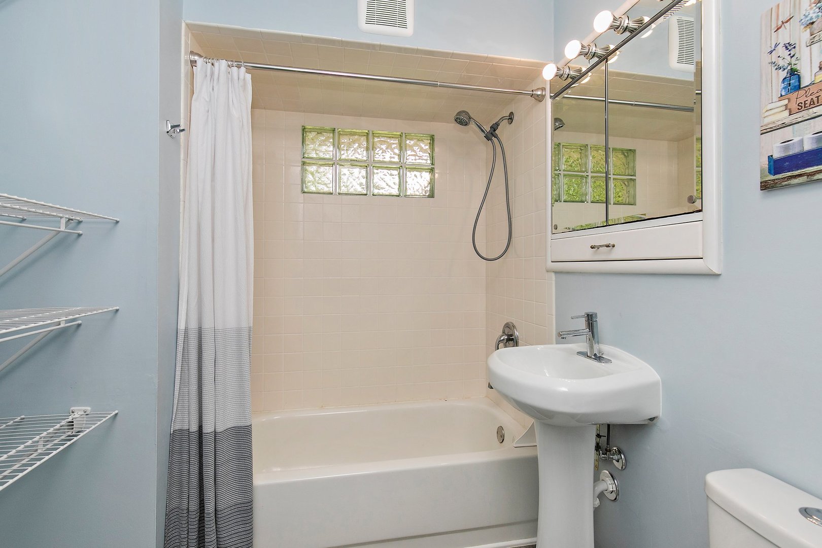 1026 Oak Ridge Road Carpentersville, IL 60110 - Photo 18 of 25 a bathroom with a sink toilet and shower