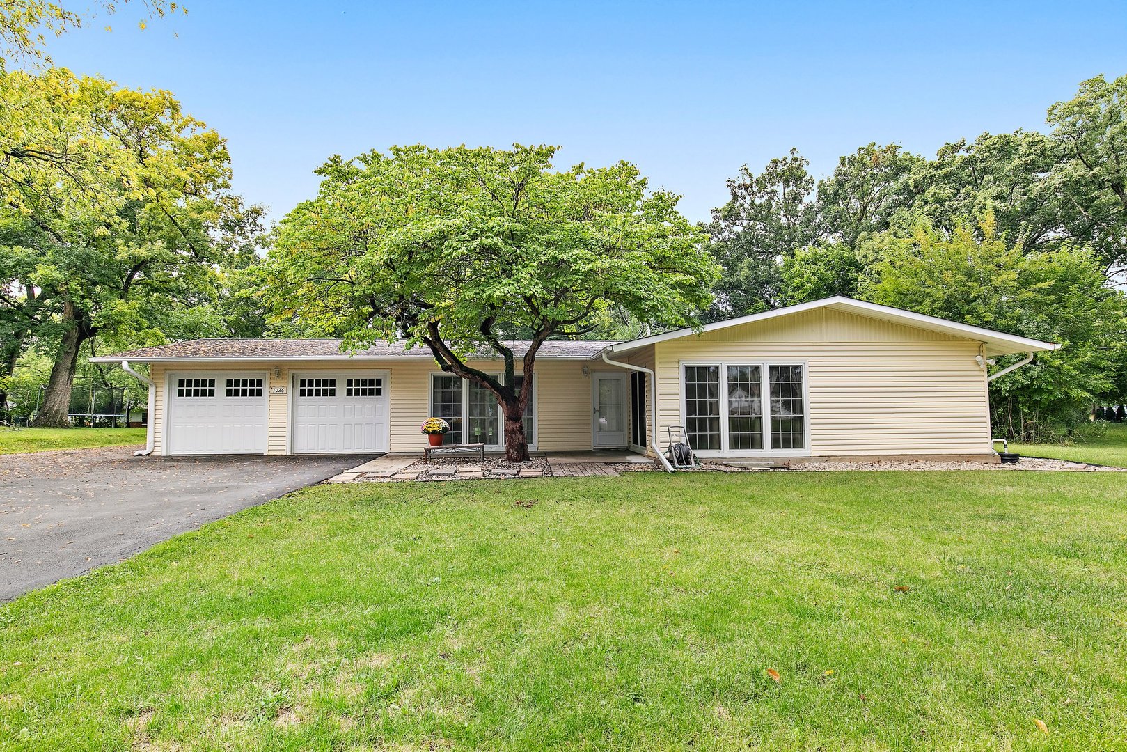 1026 Oak Ridge Road Carpentersville, IL 60110 - Photo 2 of 25 front view of a house with a yard