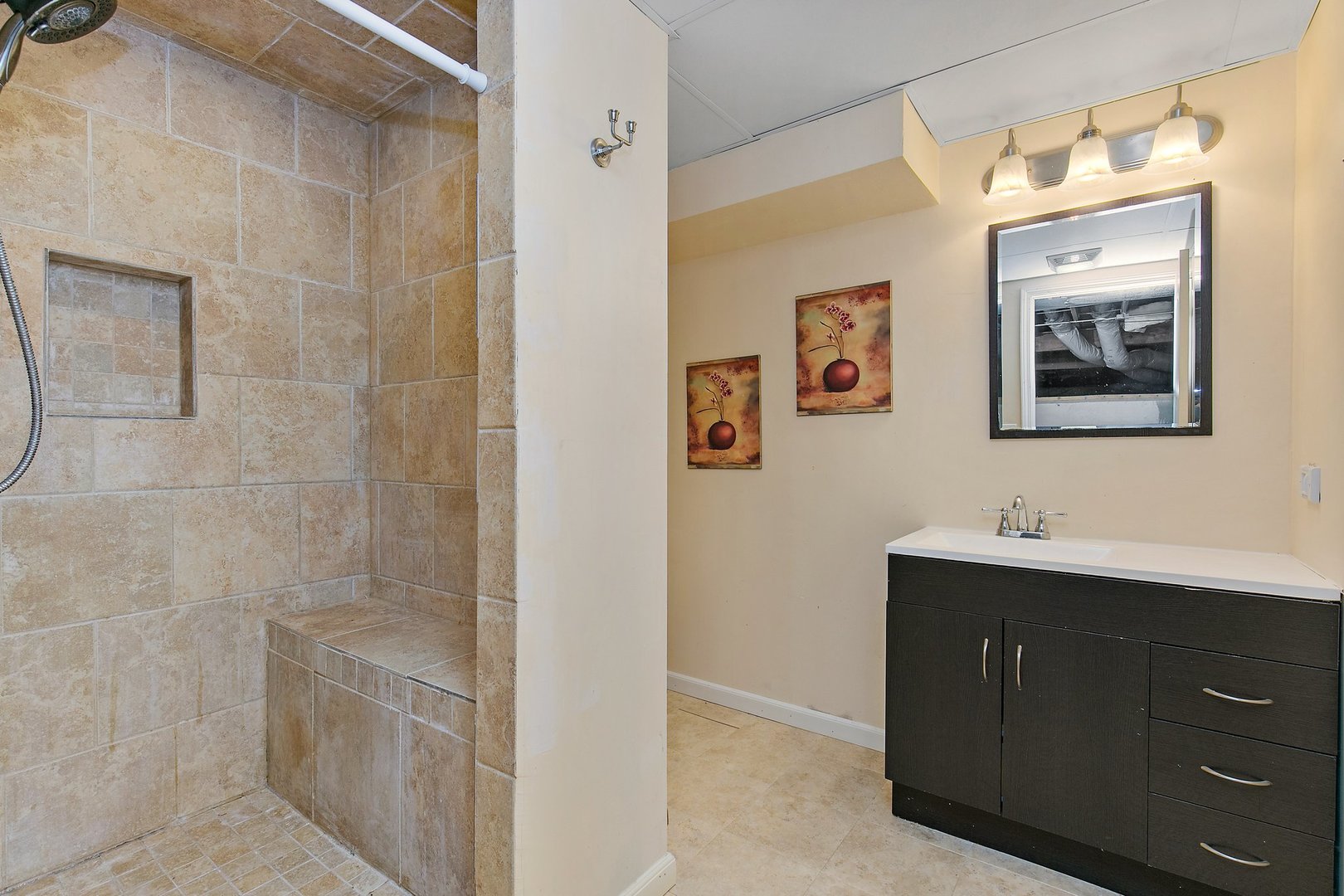 1026 Oak Ridge Road Carpentersville, IL 60110 - Photo 21 of 25 a bathroom with a sink and mirror