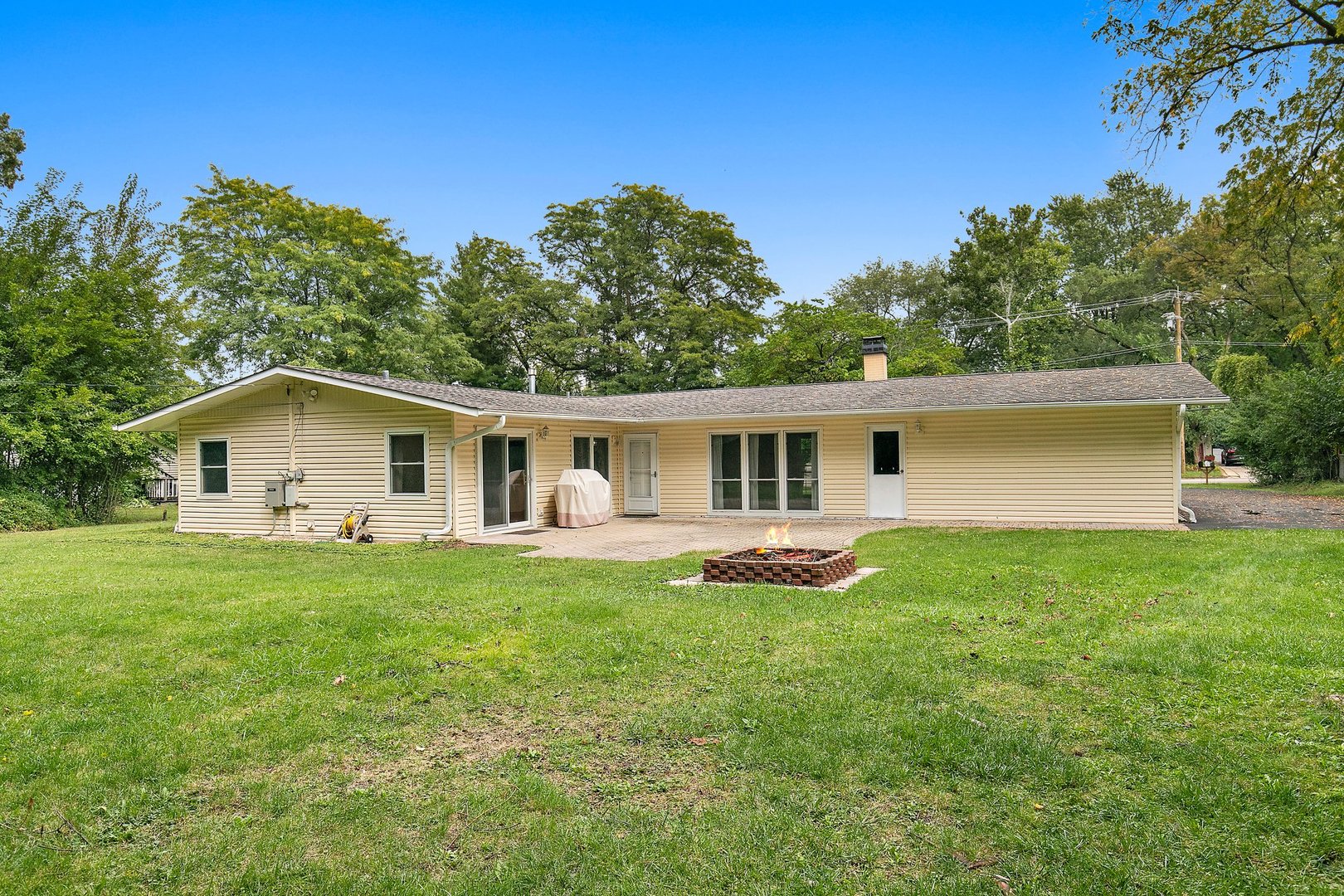 1026 Oak Ridge Road Carpentersville, IL 60110 - Photo 24 of 25 a front view of house with yard and trees