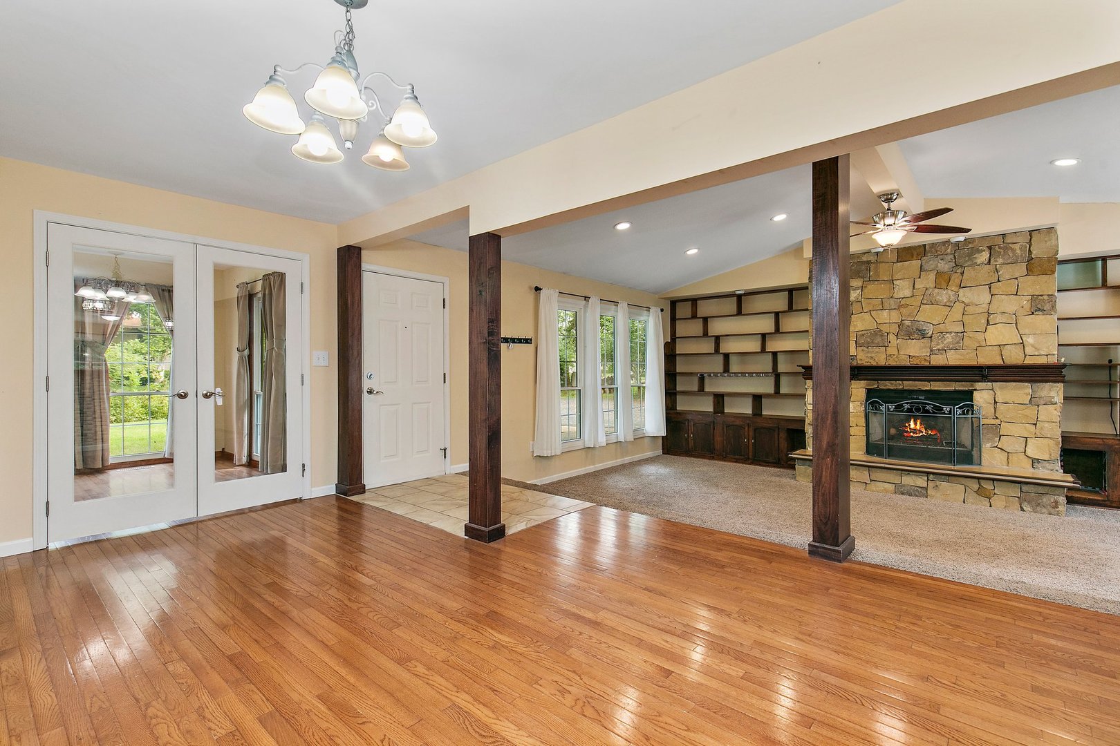 1026 Oak Ridge Road Carpentersville, IL 60110 - Photo 3 of 25 a view of an empty room with a fireplace and a window