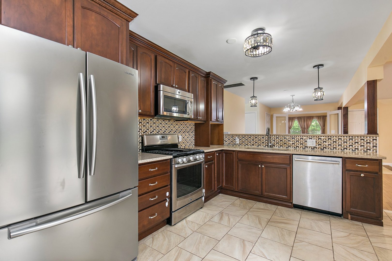 1026 Oak Ridge Road Carpentersville, IL 60110 - Photo 10 of 25 a kitchen with stainless steel appliances granite countertop a refrigerator and a stove top oven