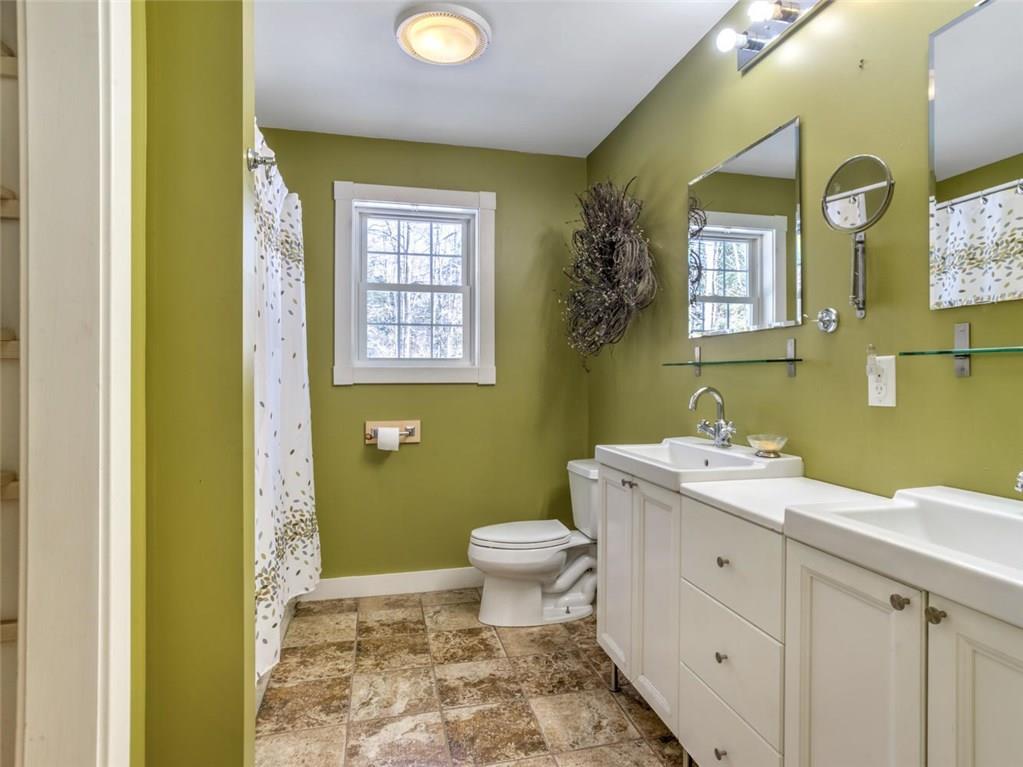 24 Emmons Road Livermore, ME 04253 - Photo 15 of 29 Full bathroom, double sinks and mirrors.