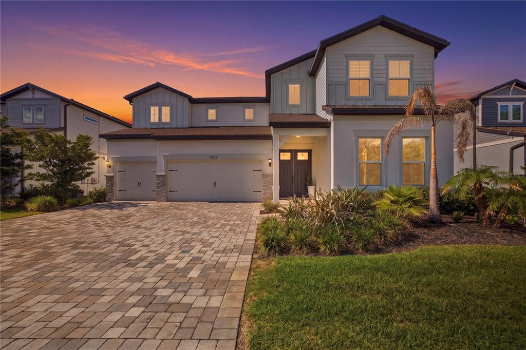 13816 Sharp Hawk Drive Riverview, FL 33569 - Photo 1 of 76 a front view of a house with a yard