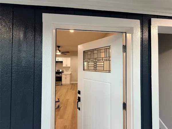 a view of a bathroom from a hallway