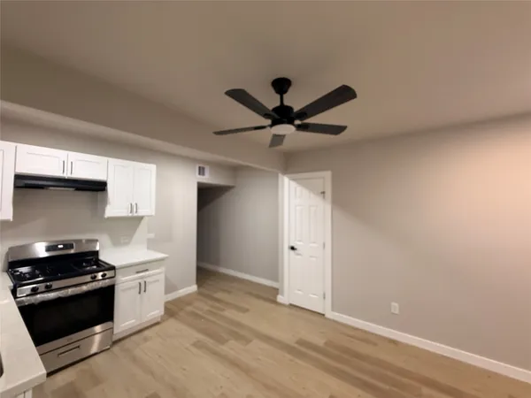 a kitchen with stainless steel appliances a stove and a refrigerator