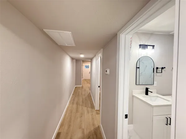 a view of a bathroom with sink and mirror