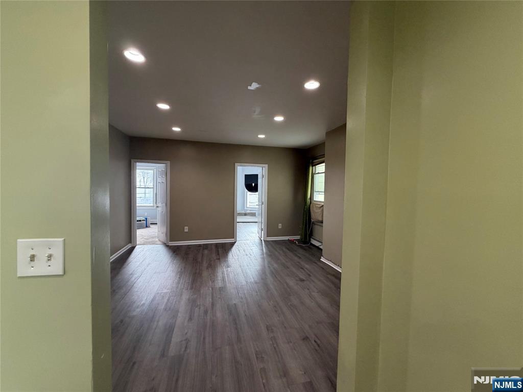 65 Grand Street Paterson, NJ 07501 - Photo 3 of 9 a view of a room with wooden floor
