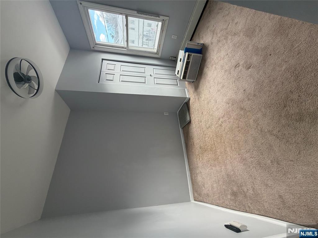 65 Grand Street Paterson, NJ 07501 - Photo 7 of 9 an empty room with windows