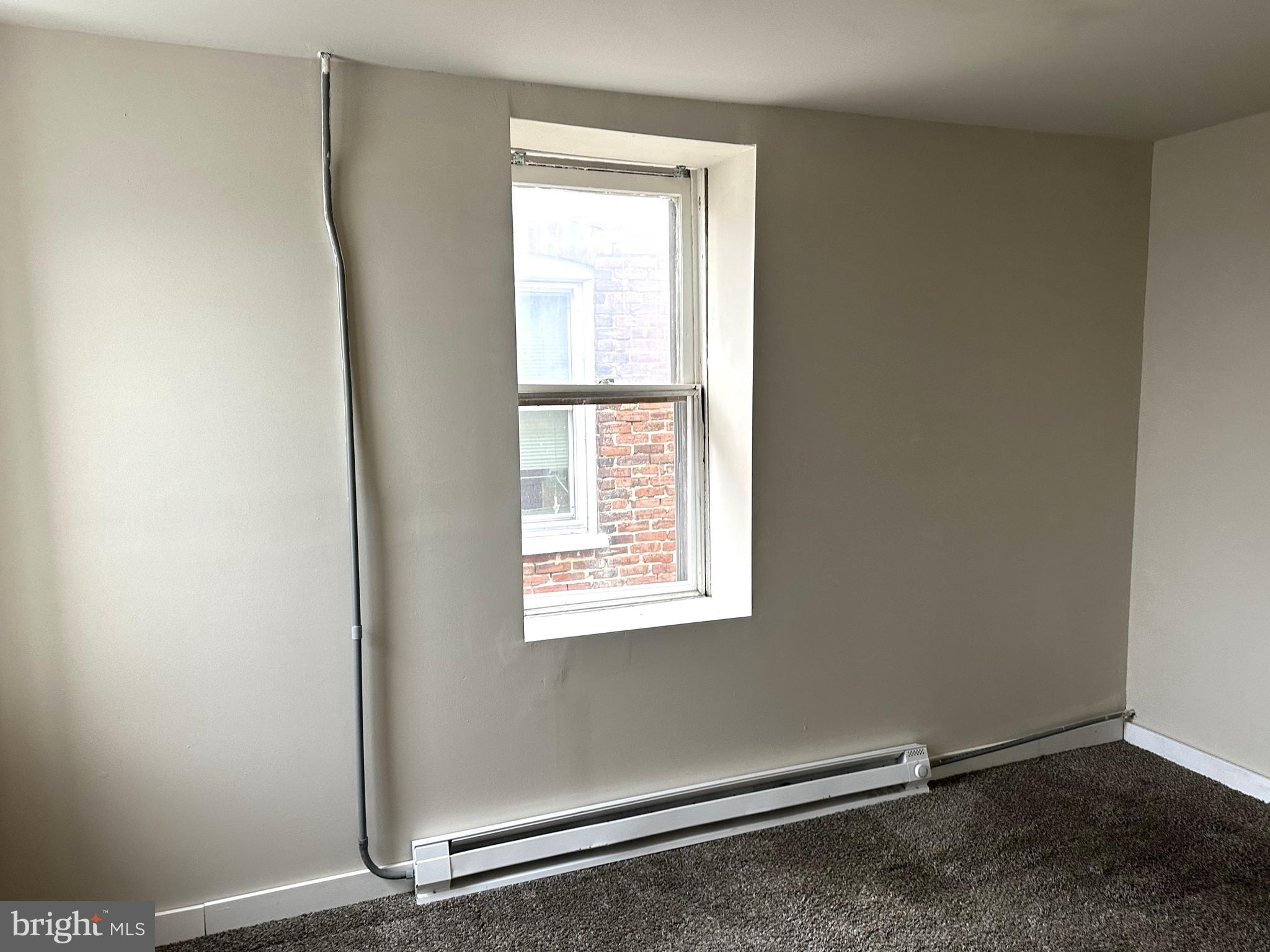 425 Highland Avenue, Unit B Chester, PA 19013 - Photo 16 of 25 a view of a room with window