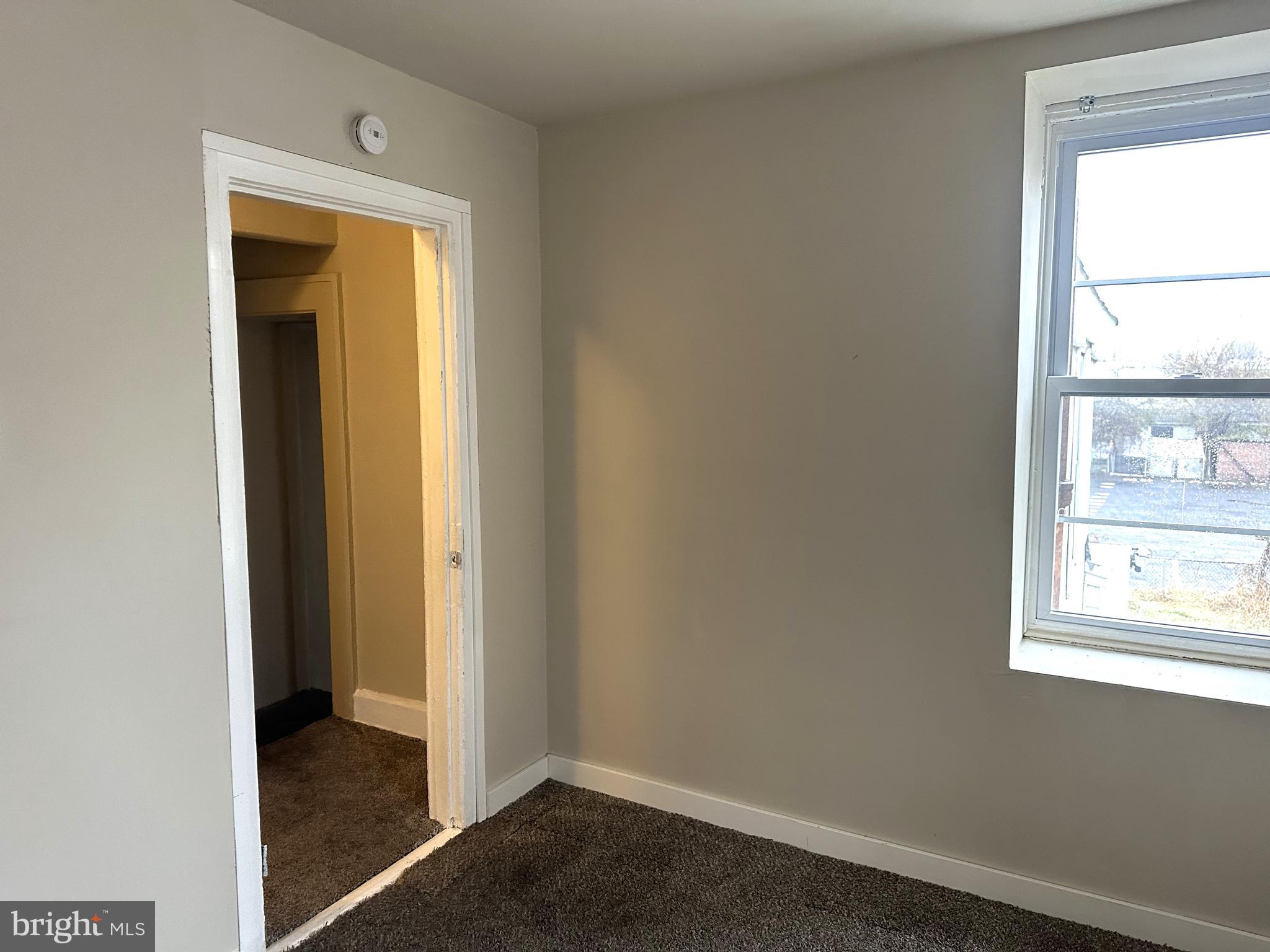 425 Highland Avenue, Unit B Chester, PA 19013 - Photo 18 of 25 a view of an empty room with a window