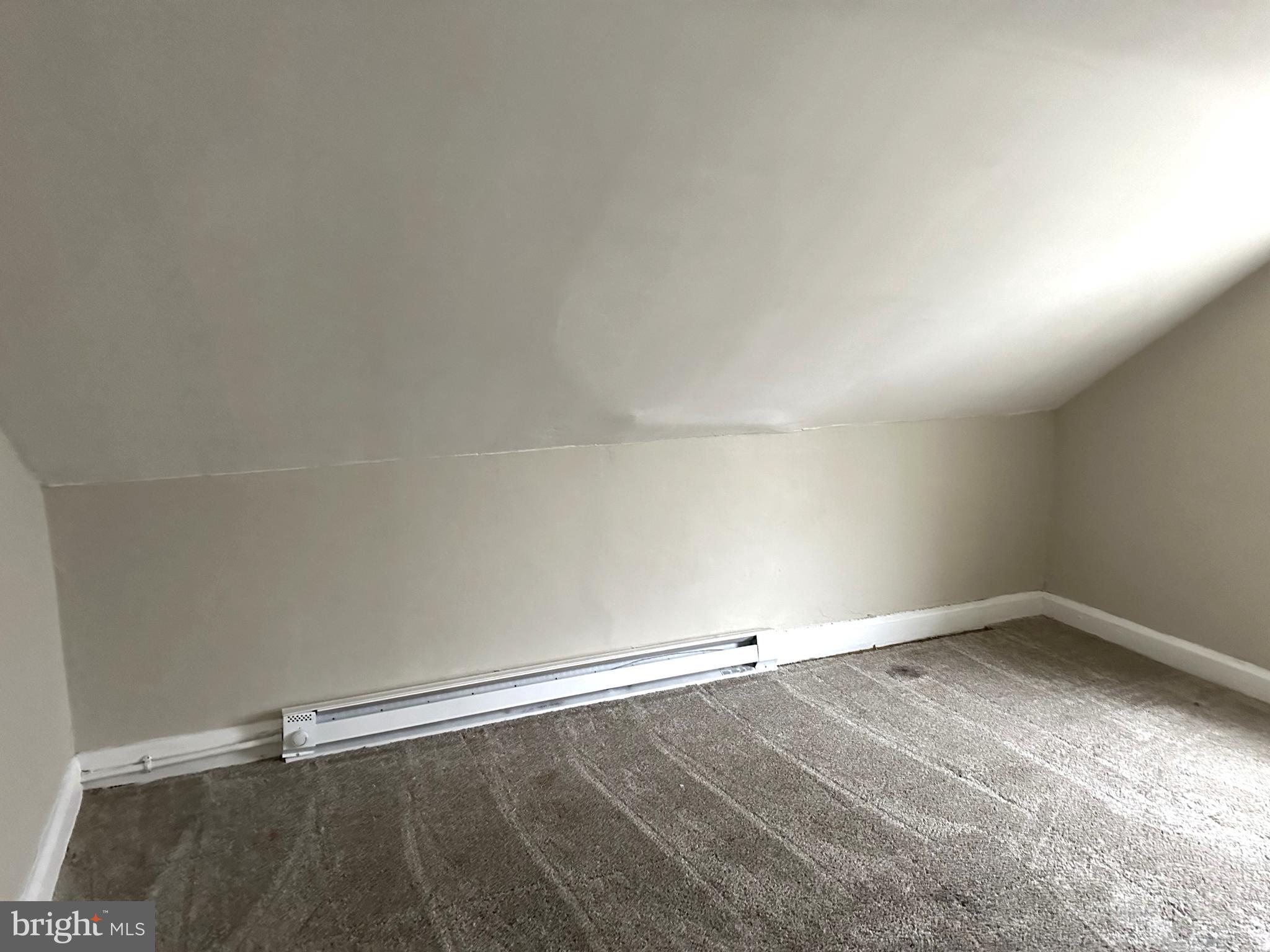 425 Highland Avenue, Unit B Chester, PA 19013 - Photo 24 of 25 an empty room with a workbench