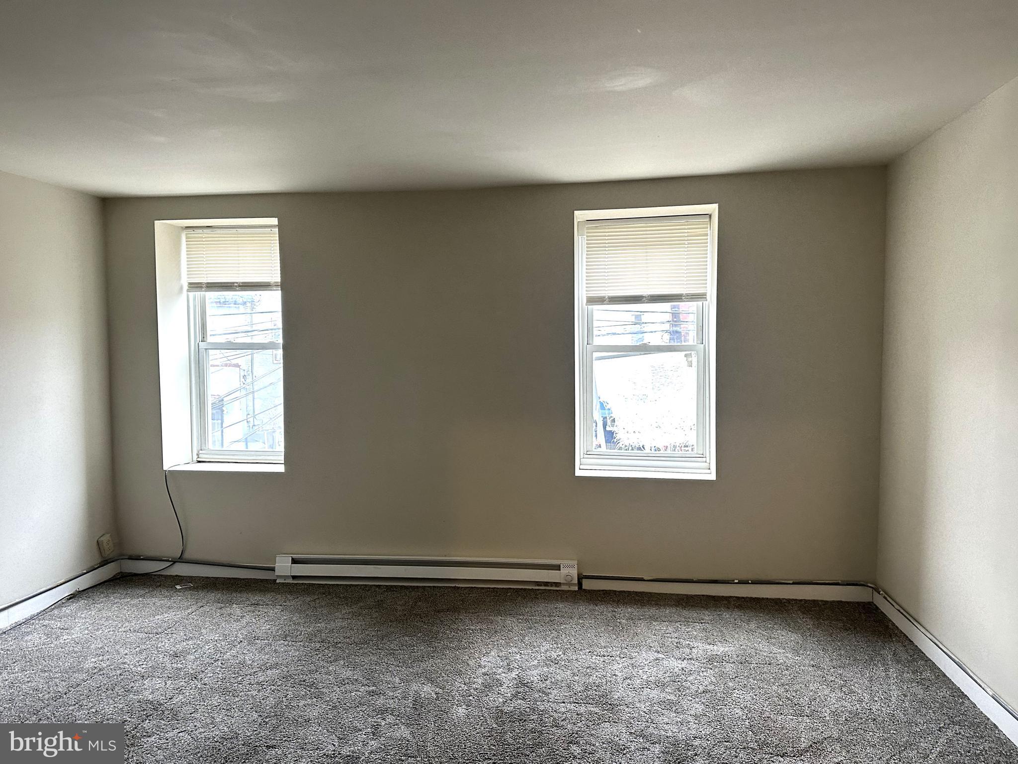 425 Highland Avenue, Unit B Chester, PA 19013 - Photo 10 of 25 an empty room with a window