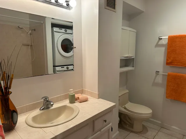 a view of a chairs and table in the patio