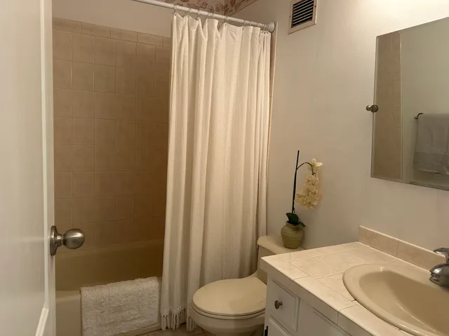 a bedroom with a bed and walk in closet