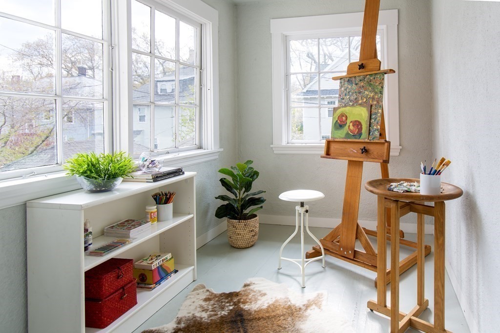 76 Prince Street Boston, MA 02130 - Photo 12 of 23 a living room filled with furniture windows and a potted plant