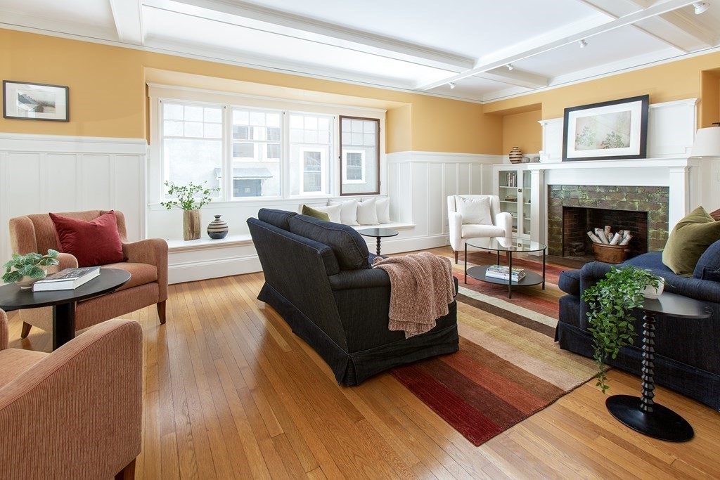 76 Prince Street Boston, MA 02130 - Photo 3 of 23 a living room with furniture and a fireplace