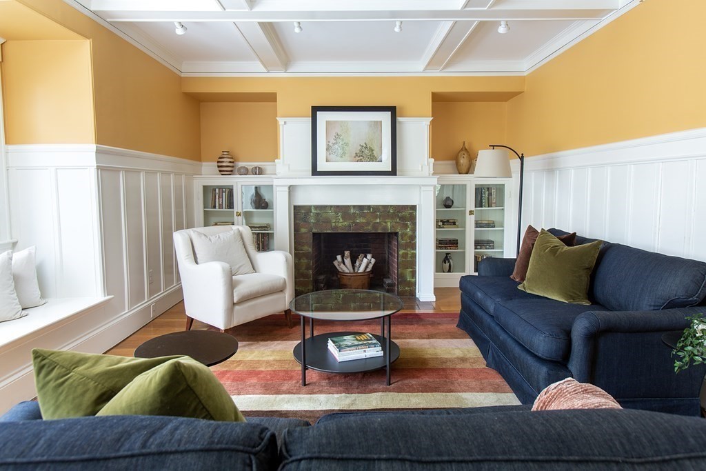 76 Prince Street Boston, MA 02130 - Photo 4 of 23 a living room with furniture and a fireplace