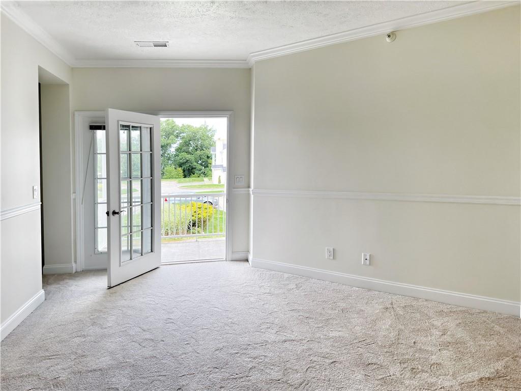 228 Adams Pointe Boulevard, Unit 7 Mars, PA 16046 - Photo 13 of 27 a view of an empty room with a window