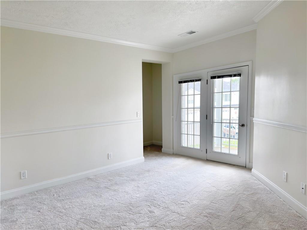 228 Adams Pointe Boulevard, Unit 7 Mars, PA 16046 - Photo 14 of 27 an empty room with windows