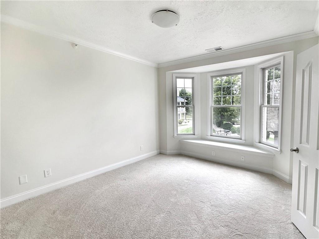 228 Adams Pointe Boulevard, Unit 7 Mars, PA 16046 - Photo 18 of 27 an empty room with windows