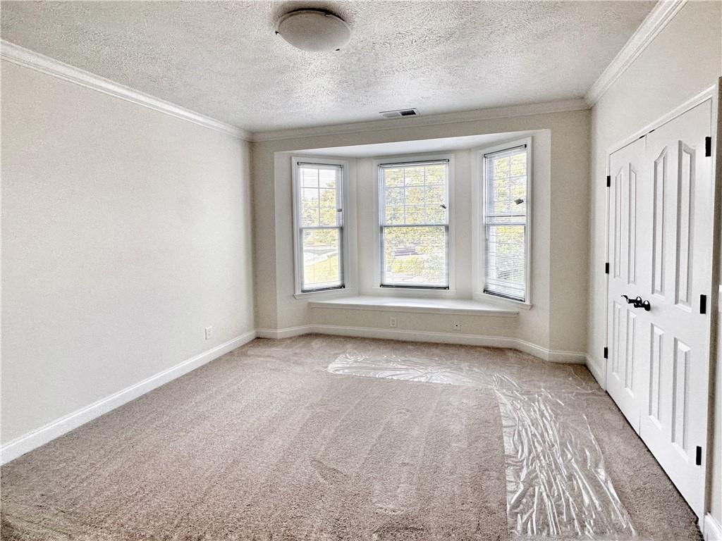 228 Adams Pointe Boulevard, Unit 7 Mars, PA 16046 - Photo 20 of 27 an empty room with windows