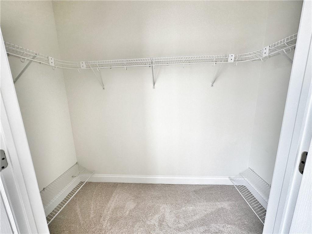 228 Adams Pointe Boulevard, Unit 7 Mars, PA 16046 - Photo 21 of 27 a view of an empty walk in closet