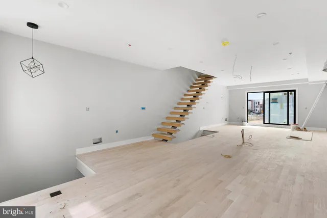 a view of a room with stairs and windows