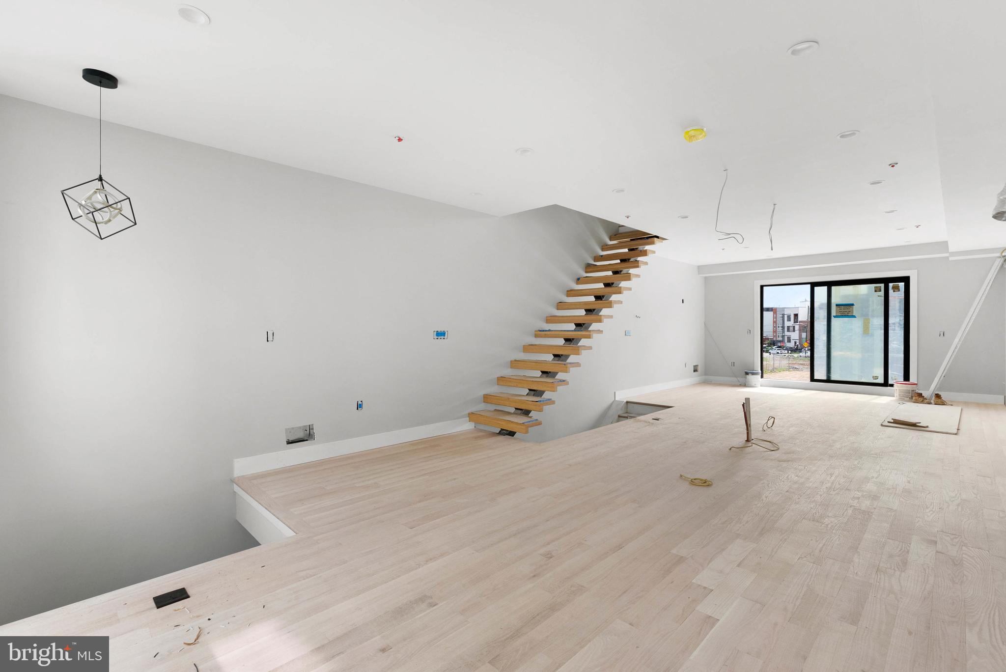 a view of a room with stairs and windows